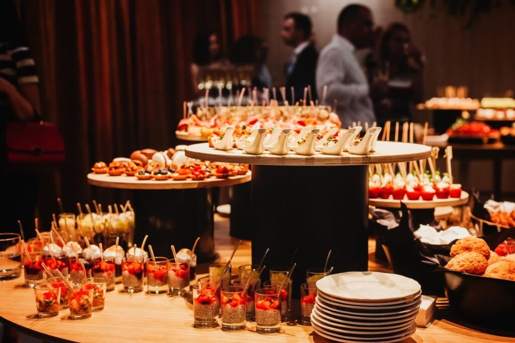 pexels-photo-8252824-8252824 A variety of gourmet appetizers displayed on an elegant buffet table at an indoor event setting.